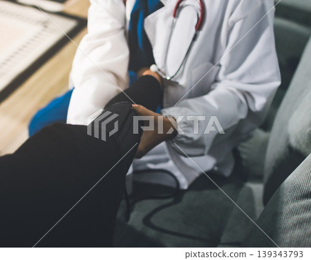 Pregnant woman having her belly examined by a doctor with a stethoscope in a clinic room highlighting a medical checkup, pregnancy health, and prenatal care Pregnant woman having her belly examined by a doctor with a stethoscope in a clinic room highlighting a medical checkup, pregnancy health, and prenatal care 139343793