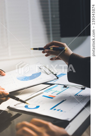Accountants processing financial documents and taxes, managing corporate finance in a modern office. Audit and taxes in business Accountants processing financial documents and taxes, managing corporate finance in a modern office. Audit and taxes in business 139343874