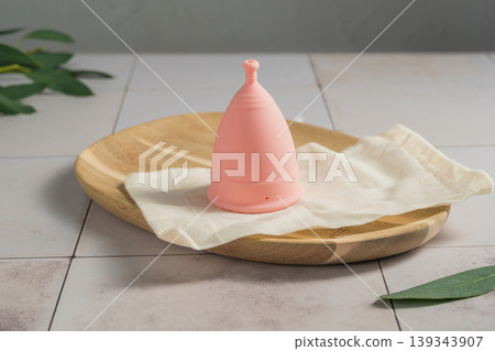 Menstrual cup. Pink feminine hygiene product. Women health concept. Menstrual cup. Pink feminine hygiene product. Women health concept. 139343907