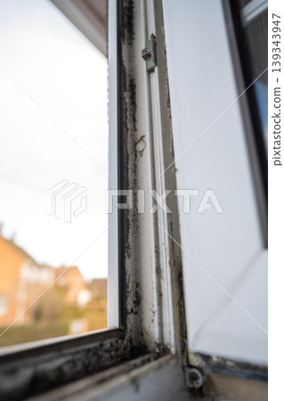 Dirty plastic window. Dust-covered plastic window frame and sill with dirt buildup and stains. Spring home cleaning concept Dirty plastic window. Dust-covered plastic window frame and sill with dirt buildup and stains. Spring home cleaning concept 139343947