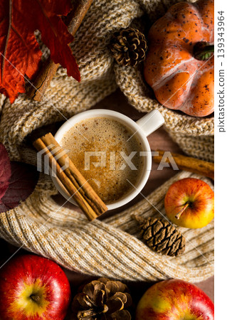Hot drink, cosy autumn coffee drink, with apples and cinnamon, orange pumpkins, wooden rustic background Hot drink, cosy autumn coffee drink, with apples and cinnamon, orange pumpkins, wooden rustic background 139343964