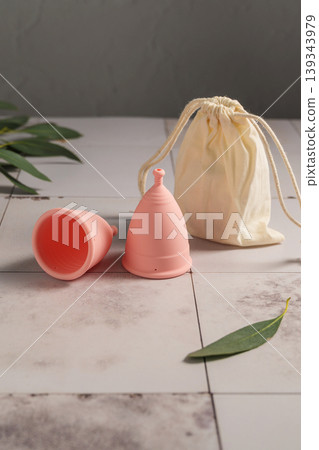 Menstrual cups. Pink feminine hygiene product. Women health concept. 139343979