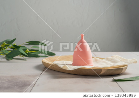 Menstrual cup. Pink feminine hygiene product. Women health concept. Menstrual cup. Pink feminine hygiene product. Women health concept. 139343989