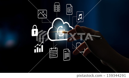 Hand Holding Stylus Touching Digital Cloud Technology Interface Visualizing Data Files, Applications, and Security with Various Icons Gantry Hand Holding Stylus Touching Digital Cloud Technology Interface Visualizing Data Files, Applications, and Security with Various Icons Gantry 139344291