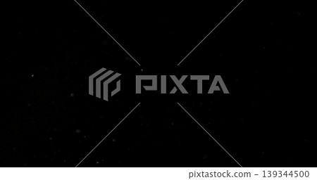 Close-up of floating dust particles in air, isolated on black background. Minimalist abstract texture with soft light, designed as VFX overlay for compositing. Close-up of floating dust particles in air, isolated on black background. Minimalist abstract texture with soft light, designed as VFX overlay for compositing. 139344500