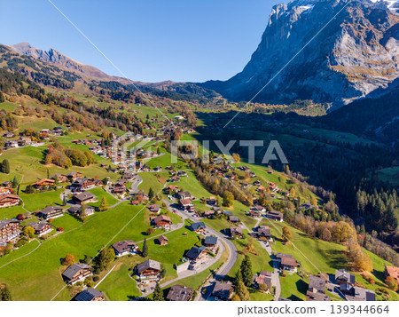 Aerial view of Grindelwald in autumn, showing the townscape and traditional wooden houses. Grindelwald, Bern Canton, Switzerland Aerial view of Grindelwald in autumn, showing the townscape and traditional wooden houses. Grindelwald, Bern Canton, Switzerland 139344664