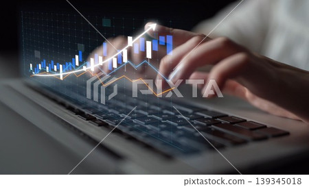 Close-up View of Hands Typing on Laptop Keyboard with Digital Graphs and Data Visualization Representing Financial Growth and Statistical Analysis Copula 139345018