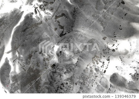 Black ink wash backgrund with swirls and cloud like marks 139346379