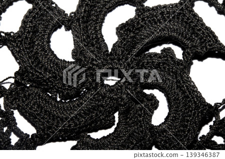 Close up of vintage black gothic lace fabric white on black background embroidery Close up of vintage black gothic lace fabric white on black background embroidery 139346387