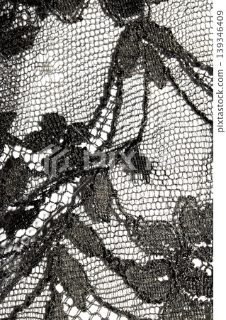 Close up of vintage black gothic lace fabric white on black background embroidery Close up of vintage black gothic lace fabric white on black background embroidery 139346409