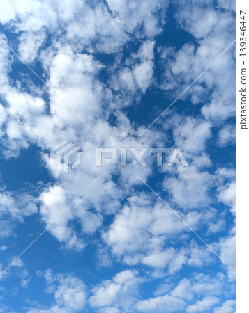 Moody white clouds across a blue black sky change in weather skyscape Moody white clouds across a blue black sky change in weather skyscape 139346447