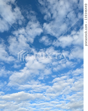 Moody white clouds across a blue black sky change in weather skyscape Moody white clouds across a blue black sky change in weather skyscape 139346449