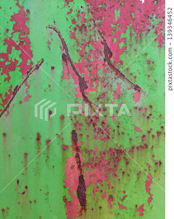 Close up of aged distressed chipped rusted paint work on a wall in green and red Close up of aged distressed chipped rusted paint work on a wall in green and red 139346452