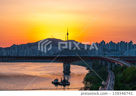 Seoul, South Korea - Apr. 24, 2026 : Sunset Cityscape of Seoul with N Seoul Tower, Seongsu Bridge and Busy Traffic on Gangbyeonbukro Highway Seoul, South Korea - Apr. 24, 2026 : Sunset Cityscape of Seoul with N Seoul Tower, Seongsu Bridge and Busy Traffic on Gangbyeonbukro Highway 139346741