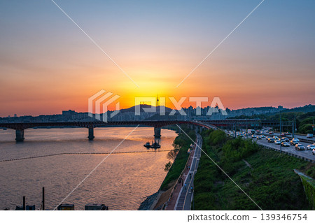 Seoul, South Korea - Apr. 24, 2026 : Sunset Cityscape of Seoul with N Seoul Tower, Seongsu Bridge and Busy Traffic on Gangbyeonbukro Highway 139346754