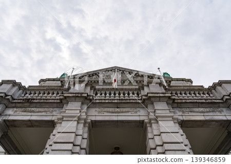 The facade of the Akasaka Palace State Guest House, standing under a cloudy sky. 139346859