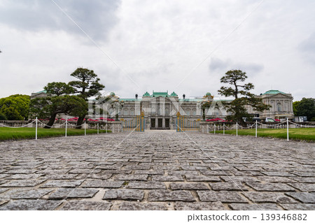The facade of the Akasaka Palace State Guest House, standing under a cloudy sky. The facade of the Akasaka Palace State Guest House, standing under a cloudy sky. 139346882