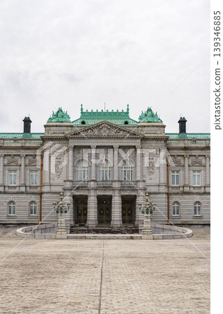 The facade of the Akasaka Palace State Guest House, standing under a cloudy sky. 139346885