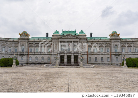 The facade of the Akasaka Palace State Guest House, standing under a cloudy sky. The facade of the Akasaka Palace State Guest House, standing under a cloudy sky. 139346887