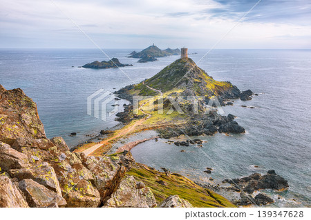 Amazing sunset over Torra di a Parata with Genoese Tower and Archipelago of Sanguinaires islands at background. Amazing sunset over Torra di a Parata with Genoese Tower and Archipelago of Sanguinaires islands at background. 139347628