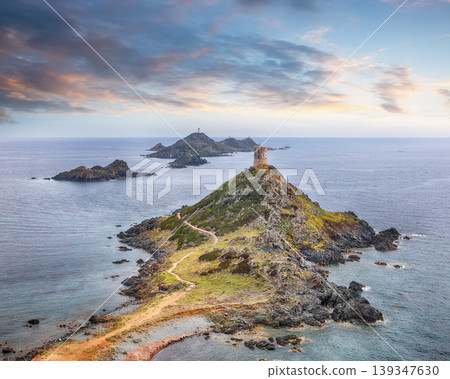 Fantastic sunset over Torra di a Parata with Genoese Tower and Archipelago of Sanguinaires islands at background. Fantastic sunset over Torra di a Parata with Genoese Tower and Archipelago of Sanguinaires islands at background. 139347630