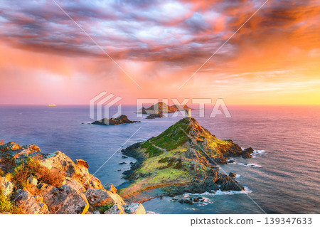 Amazing sunset over Torra di a Parata with Genoese Tower and Archipelago of Sanguinaires islands at background. 139347633