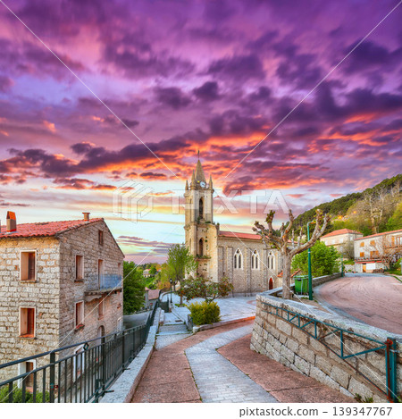 Amazing evening cityscape with Parish Church of the Assumption in Zonza village with typical stone houses Amazing evening cityscape with Parish Church of the Assumption in Zonza village with typical stone houses 139347767