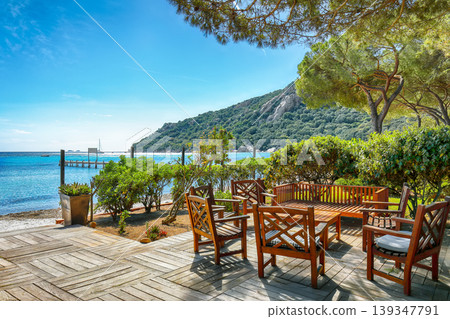 Breathtaking view of Santa Giulia resort from beach bar. Breathtaking view of Santa Giulia resort from beach bar. 139347791