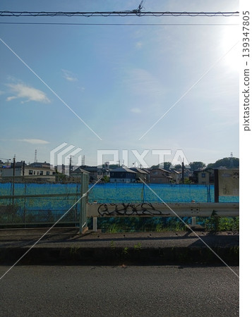 Blue tarpaulins on a construction site and the suburbs in summer Blue tarpaulins on a construction site and the suburbs in summer 139347805