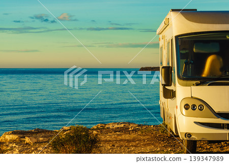 Caravan recreational vehicle camping on sea shore. 139347989
