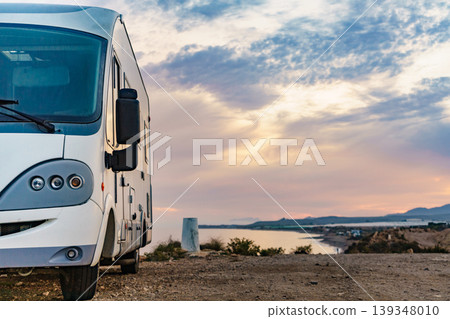 Caravan recreational vehicle camping on sea shore. 139348010