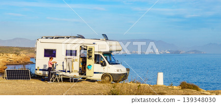 Caravan with chairs camping equipment ready for outdoor living. Caravan with chairs camping equipment ready for outdoor living. 139348030