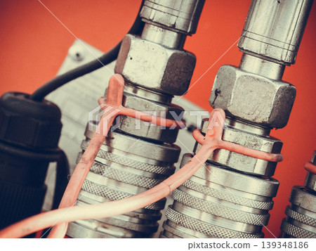 Detailed closeup of spark plugs in machine engine Detailed closeup of spark plugs in machine engine 139348186