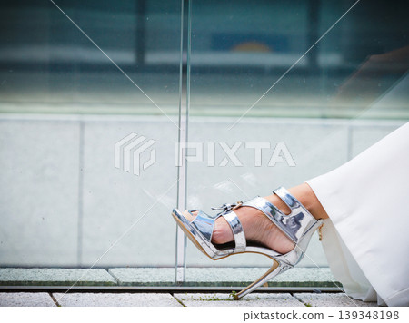 Woman wearing high heels and culottes Woman wearing high heels and culottes 139348198