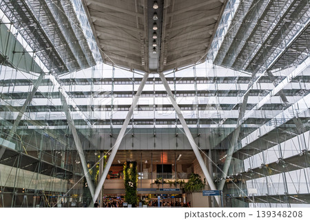 Large glass atrium with structural beams and multi level interior Large glass atrium with structural beams and multi level interior 139348208