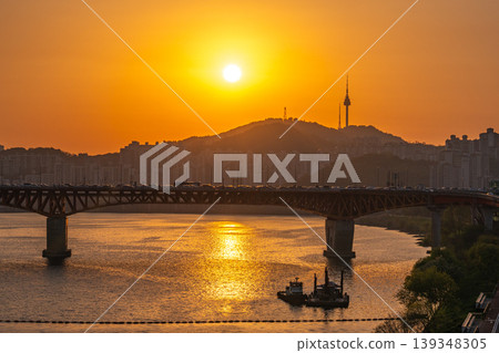 Seoul, South Korea - Apr. 24, 2026 : Sunset Cityscape of Seoul with N Seoul Tower, Seongsu Bridge and Busy Traffic on Gangbyeonbukro Highway Seoul, South Korea - Apr. 24, 2026 : Sunset Cityscape of Seoul with N Seoul Tower, Seongsu Bridge and Busy Traffic on Gangbyeonbukro Highway 139348305