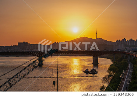 Seoul, South Korea - Apr. 24, 2026 : Sunset Cityscape of Seoul with N Seoul Tower, Seongsu Bridge and Busy Traffic on Gangbyeonbukro Highway Seoul, South Korea - Apr. 24, 2026 : Sunset Cityscape of Seoul with N Seoul Tower, Seongsu Bridge and Busy Traffic on Gangbyeonbukro Highway 139348306