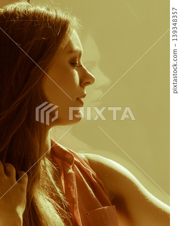 Woman looking through window, relaxing Woman looking through window, relaxing 139348357