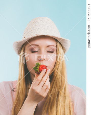 Happy woman holding strawberries 139348493