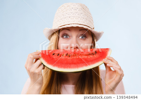 Happy woman holding watermelon Happy woman holding watermelon 139348494