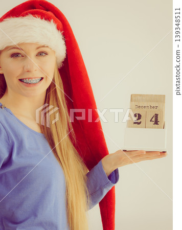 Christmas woman holding calendar. Christmas woman holding calendar. 139348511