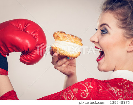 Woman boxing cream cupcake Woman boxing cream cupcake 139348575