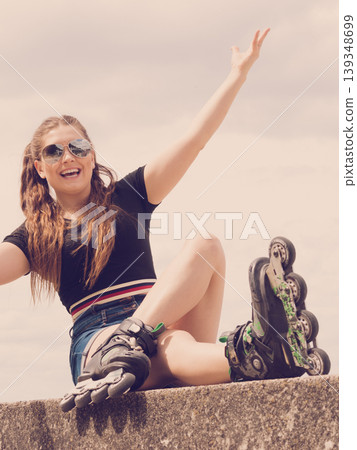 Fit girl with roller skates outdoor Fit girl with roller skates outdoor 139348699