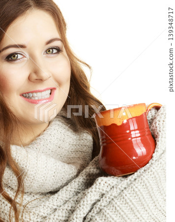 Woman holding red tea coffee mug Woman holding red tea coffee mug 139348717