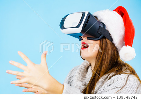 Girl watching 3d film tour in virtual reality glasses. Girl watching 3d film tour in virtual reality glasses. 139348742