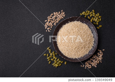 White sesame seeds in a bowl, an ingredient for oil and healthy eating. White sesame White sesame seeds in a bowl, an ingredient for oil and healthy eating. White sesame 139349049