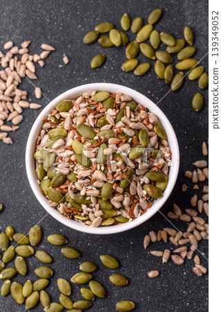 Shelled sunflower, sesame, pumpkin, and flaxseed kernels as ingredients for healthy food Shelled sunflower, sesame, pumpkin, and flaxseed kernels as ingredients for healthy food 139349052