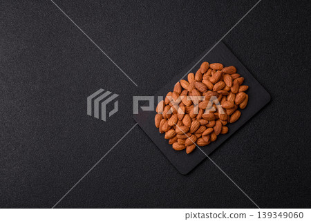 Raw and peeled almonds as a healthy food ingredient. Almonds as a food background Raw and peeled almonds as a healthy food ingredient. Almonds as a food background 139349060