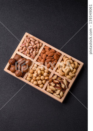 A mix of cashews, pistachios, almonds, macadamia and hazelnuts. Nuts as a food background A mix of cashews, pistachios, almonds, macadamia and hazelnuts. Nuts as a food background 139349061