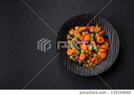 Dried apricots, raisins, and candied fruits as ingredients for baked goods and sweets. Dried fruits 139349066
